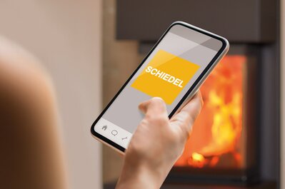 Telefon med Schiedel-logo